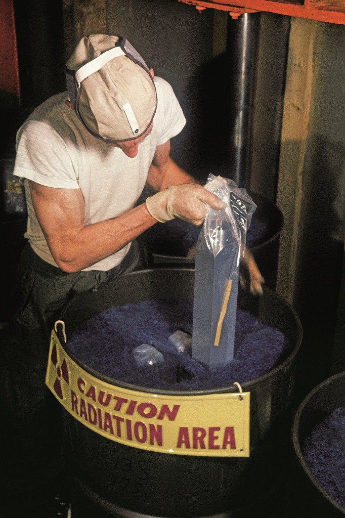 GREENLAND - MAY 01: Technician unpacks atomic fuel for a polar station's nuclear reactor, Camp Century, Greenland (Photo by W. Robert Moore/National Geographic/Getty Images)