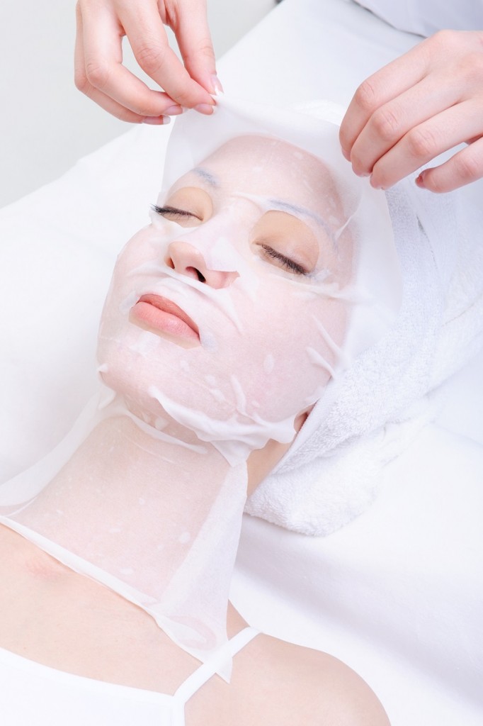 spa treatment for young woman's face in the beauty salon