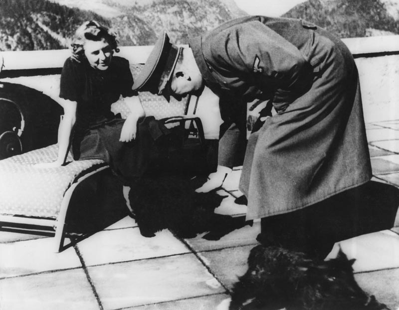Adolf Hitler and Eva Braun with their dogs at their Bavarian retreat in Berchtesgaden