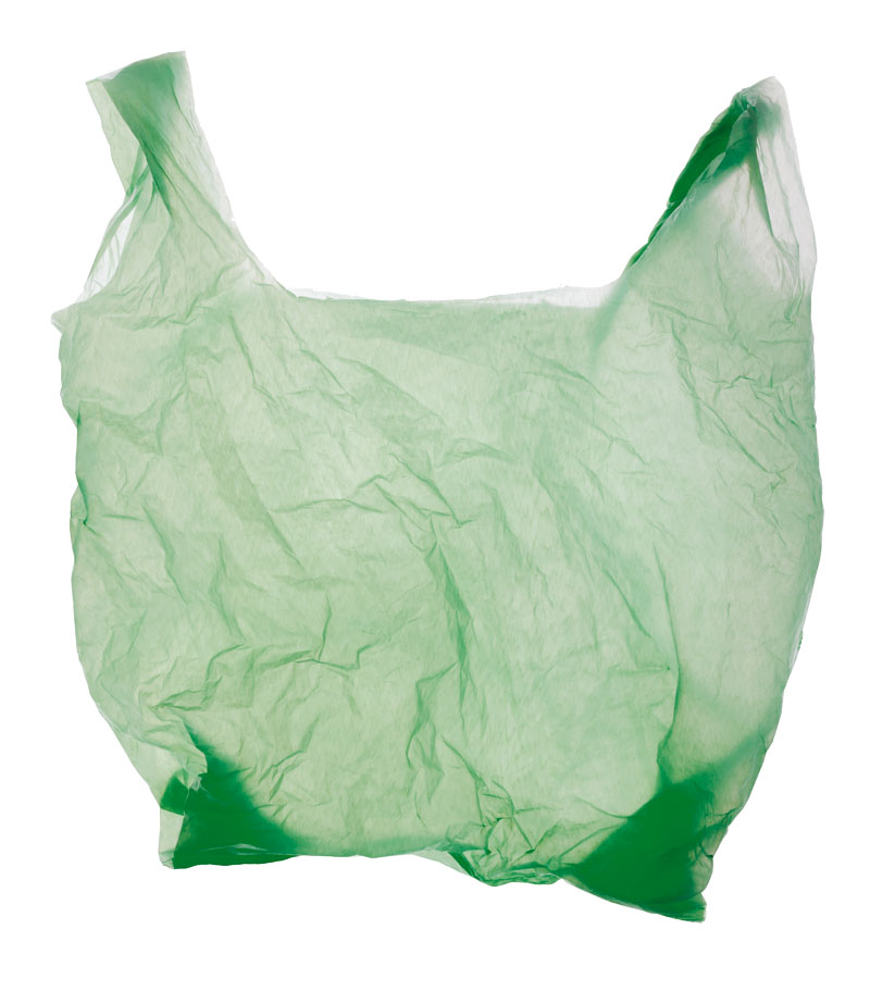 Green plastic bag isolated on white.