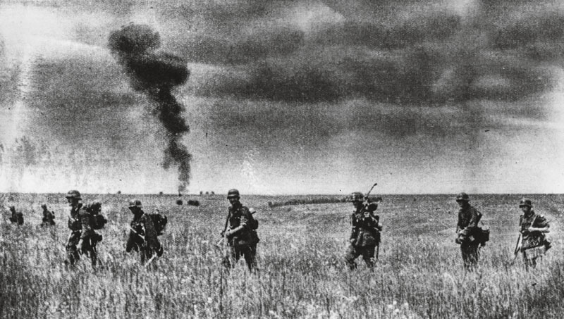August 1942: Nazi troops advance through the richest wheat producing territory of Russia, in the Don river area. A plume of smoke rises from the horizon. (Photo by Keystone/Getty Images)